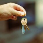 A person holding a bunch of keys in their hand